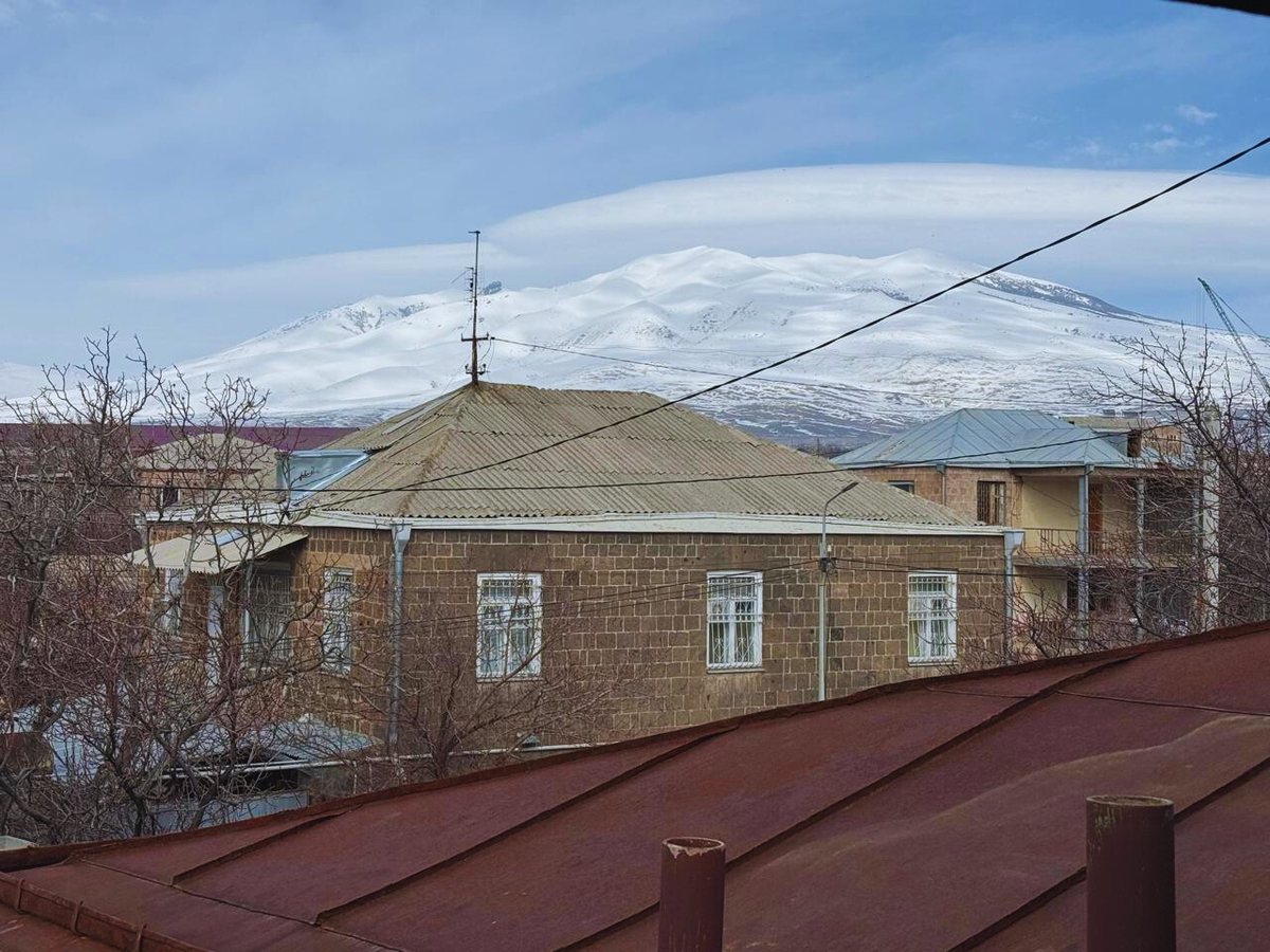View from the attic towards neighbouring houses and the mountains