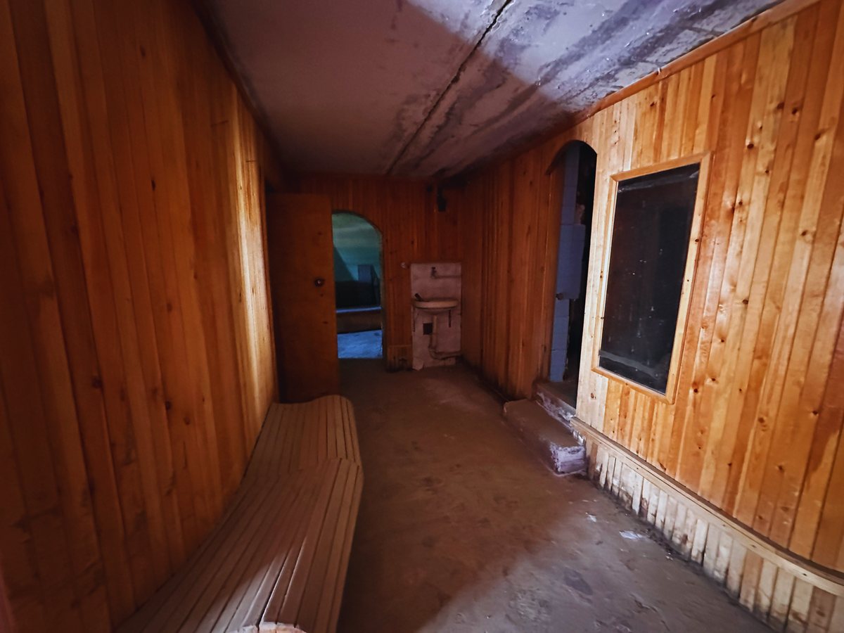 Bar area on the ground level with wooden interior, current condition