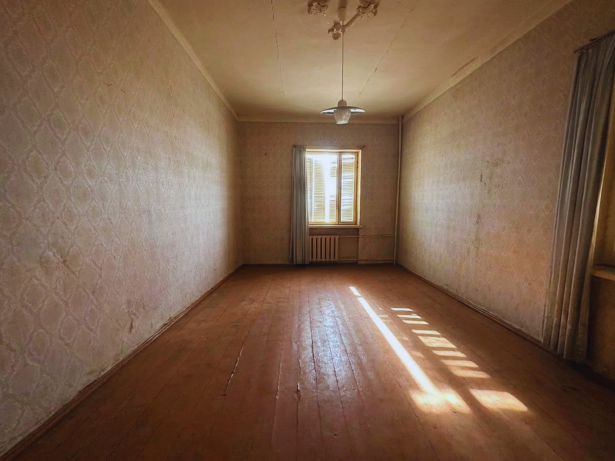 Bedroom one on the main residential floor, current condition