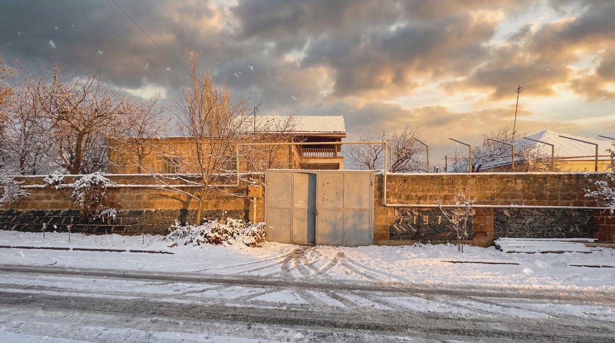 Street view of the property in winter